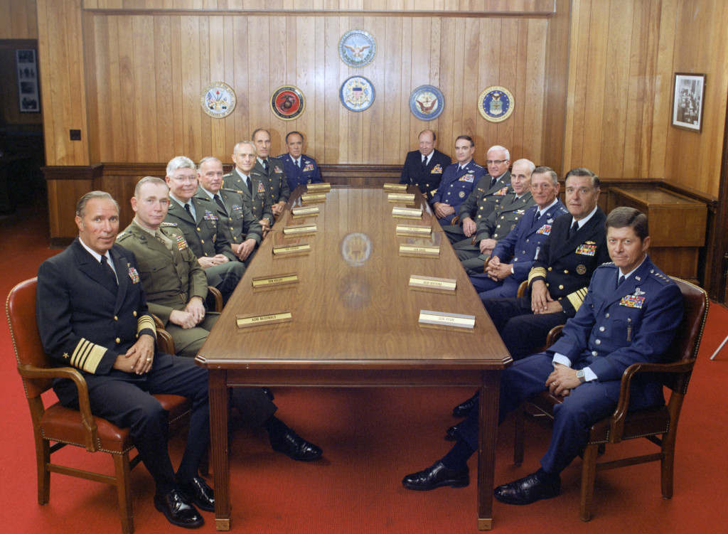 This is a group photograph of the Joint Chiefs of Staff and several Commanders in Chiefs taken on July 1, 1983, in the Chairman of the Joint Chiefs of Staff dining room, located in the Pentagon. Shows (left to right): U.S. Navy Adm. Wesley L. McDonald, Commander in Chief, US Atlantic Command; U.S. Marine Corps Gen. Paul X. Kelley, Commandant of the Marine Corps; U.S. Army Gen. Paul F. Gorman, Commander in Chief, US Southern Command; U.S. Army Lt. Gen. Robert C. Kingston, Commander in Chief, US Central Command; U.S. Army Gen. John A. Wickham, Chief of Staff, US Army; U.S. Army Gen. Wallace H. Nutting, Commander in Chief, US Readiness Command; U.S. Air Force Gen. James V. Hartinger, Commander in Chief, Aerospace Defense Command; U.S. Navy Adm. William J. Crowe, Commander in Chief, US Pacific Command; U.S. Air Force Gen. Charles A. Gabriel, Chief of Staff, U.S. Air Force; U.S. Army Bernard W. Rogers, Commander in Chief, US European Command; U.S. Army Gen. John W. Vessey, Jr., Chairman of the Joint Chiefs of Staff; U.S. Air Force Gen. Bennie L. Davis, Commander in Chief, US Strategic Air Command; U.S. Navy Adm. James D. Watkins, Chief of Naval Operations; and U.S. Air Force Gen. Thomas M. Ryan, Commander in Chief, Military Airlift Command. OSD Package No. A07D-00347 (DOD Photo by Robert D. Ward) (Released)